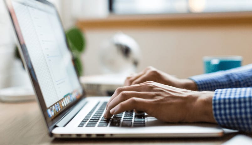 Person Typing On Computer